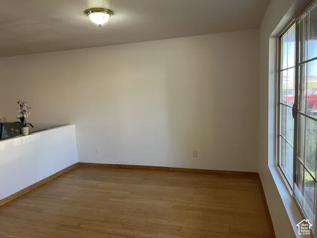 Wood-finish flooring with coordinating baseboards