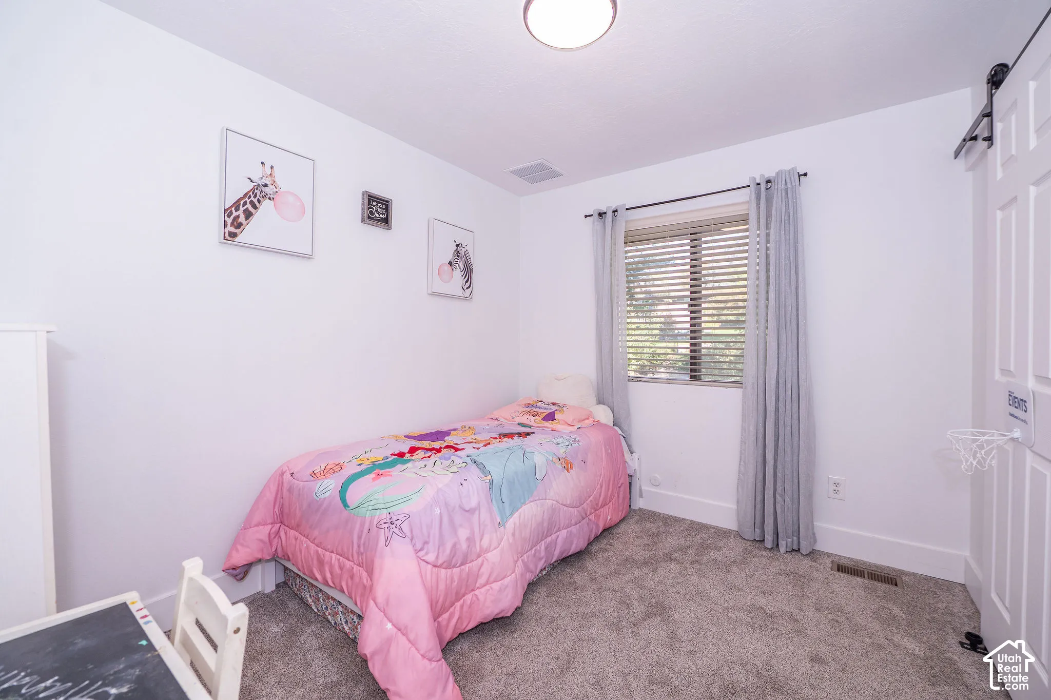 Bedroom 1. Window with blinds, curtains, overhead flush-mount lighting, and wall-to-wall carpeting
