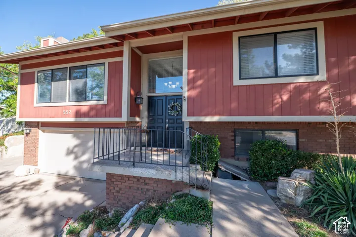 Front Entryway, Red vertical siding exterior with brick accents