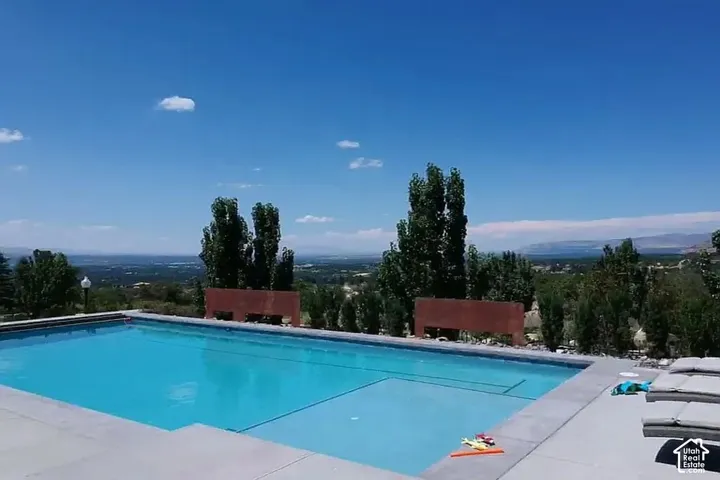 In-ground swimming pool with a surrounding concrete deck