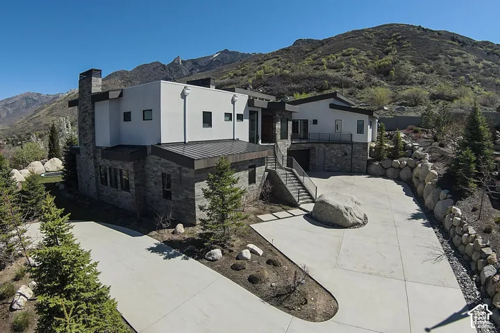 Modern architectural style with stone and stucco exterior finishes