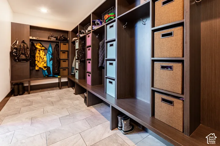 Custom built-in storage system with cubbies and integrated benches