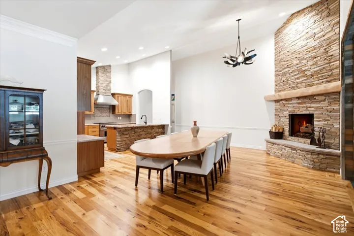 Open concept dining and kitchen area featuring wood-finish flooring