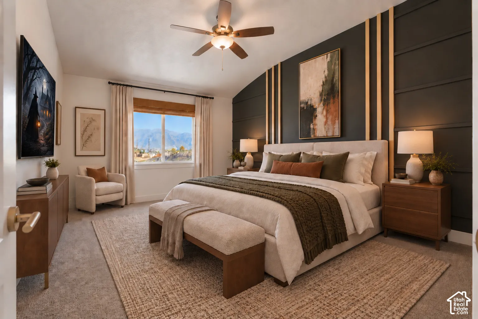 Vaulted ceiling with a ceiling fan, accent wall with vertical wood trim, expansive window, wall-to-wall carpeting, and wood-finish cabinetry