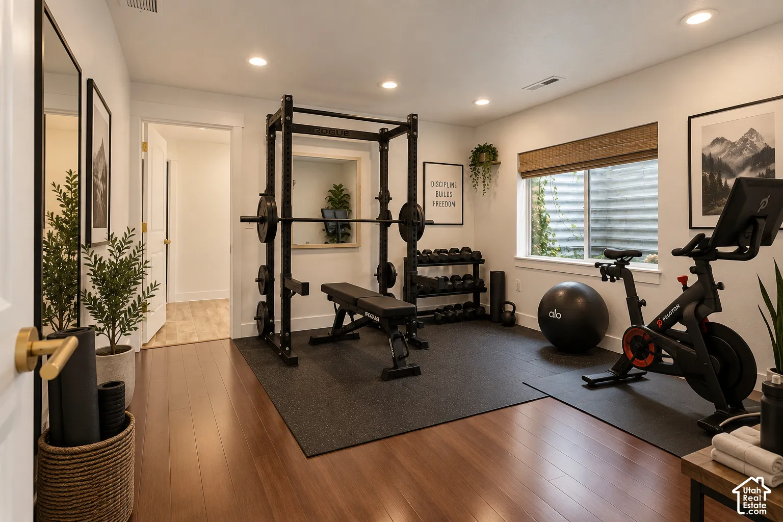 Recessed lighting, wood-finish flooring, and a large window. Could be used as bedroom #6.