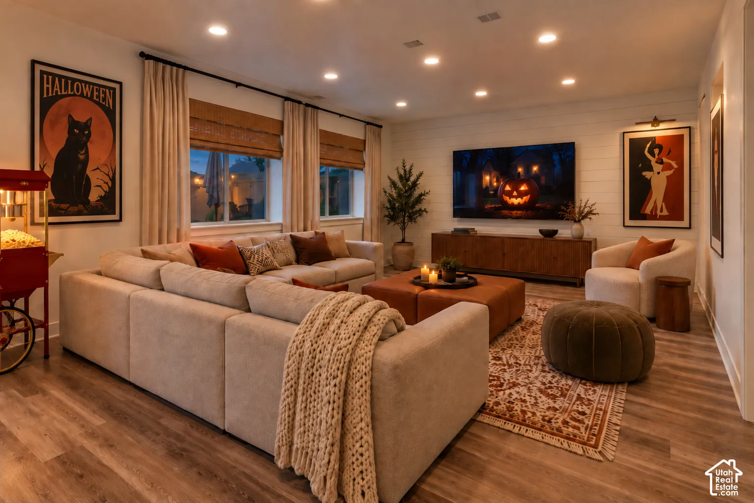 Recessed lighting throughout, wood-finish flooring, shiplap accent wall, multiple windows with blinds, and drapery