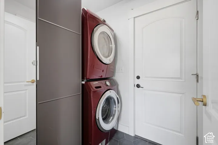 Integrated stacked laundry units with door to the garage.