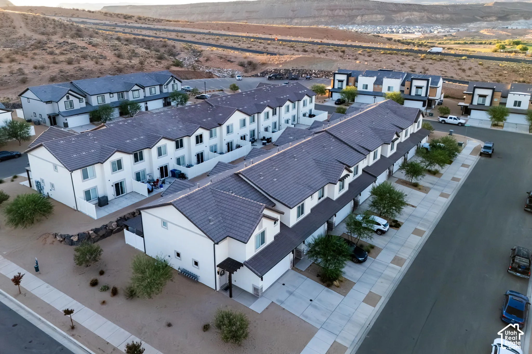 Modern townhome community featuring desert-adapted landscaping, paved streets, and sidewalks
