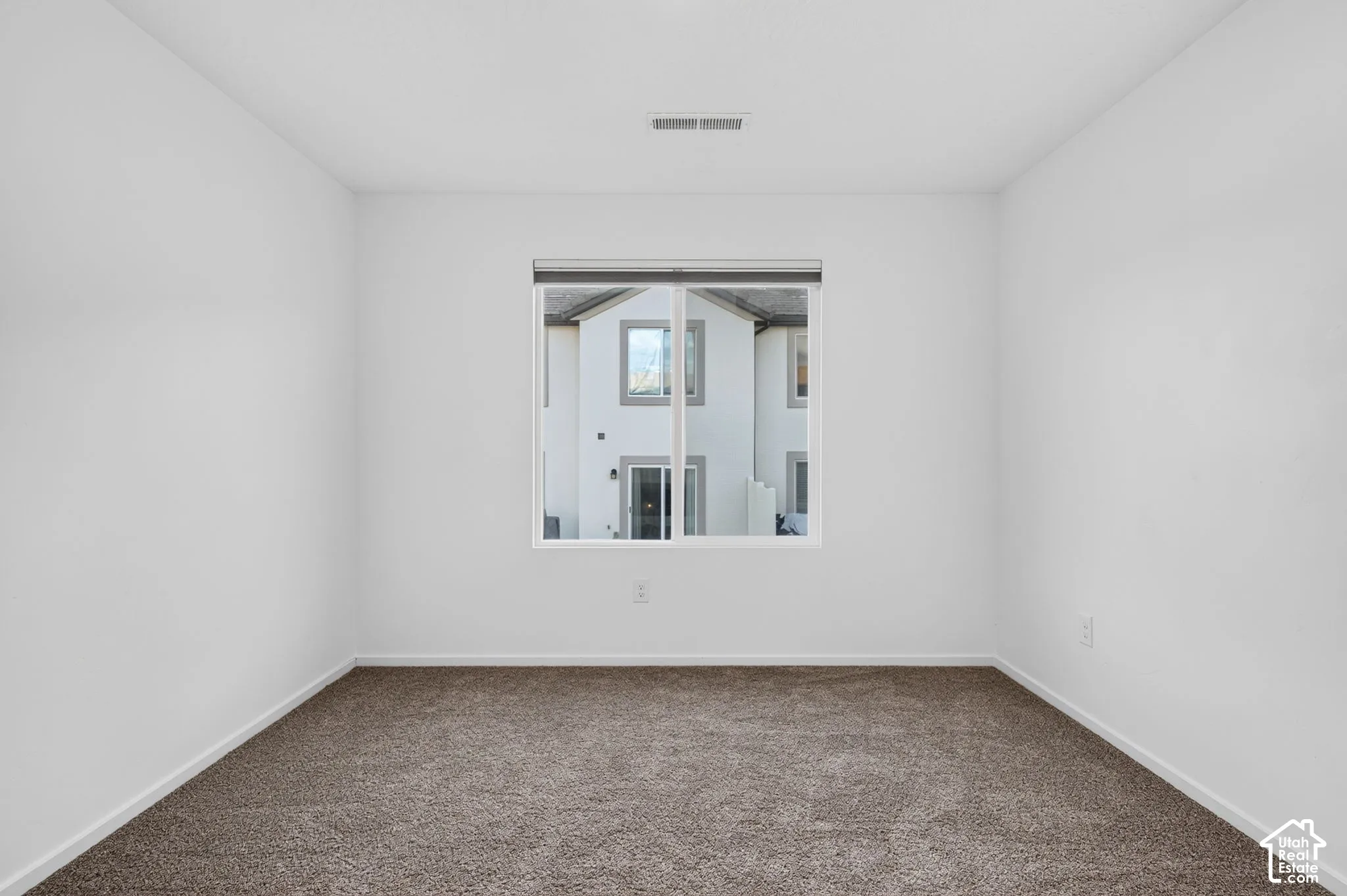 Neutral wall color with a framed window