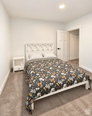 Recessed ceiling lighting, durable carpet flooring, solid core interior doors, and a built-in closet with shelving