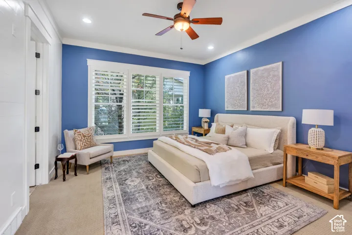 Recessed lighting, crown molding, wood-finish ceiling fan, and plantation shutters