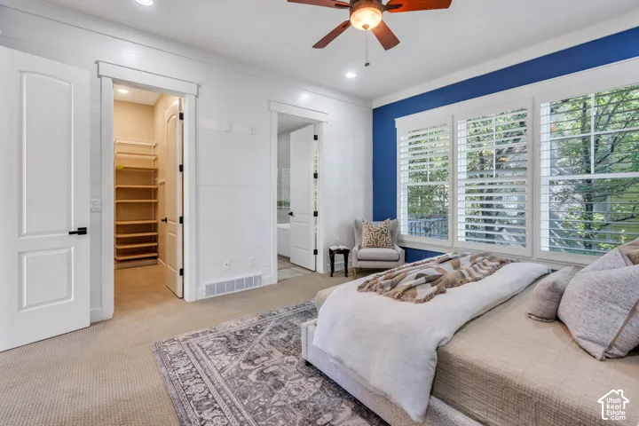 Recessed lighting, ceiling fan, carpeted flooring, custom closet shelving, and plantation shutters