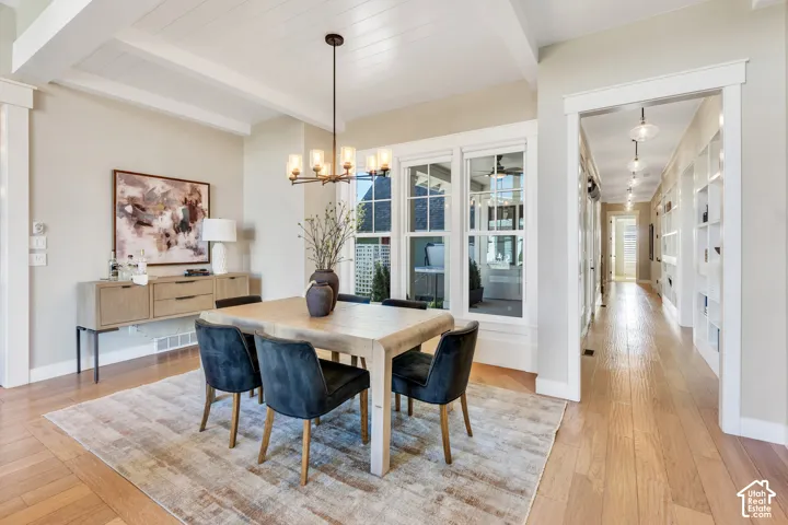 Tray ceiling with wood paneling and exposed beams
