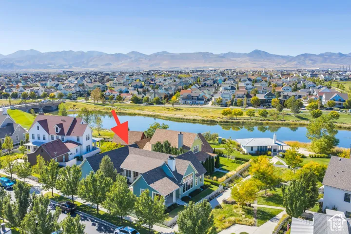Aerial perspective showcasing a residential community with a prominent water feature