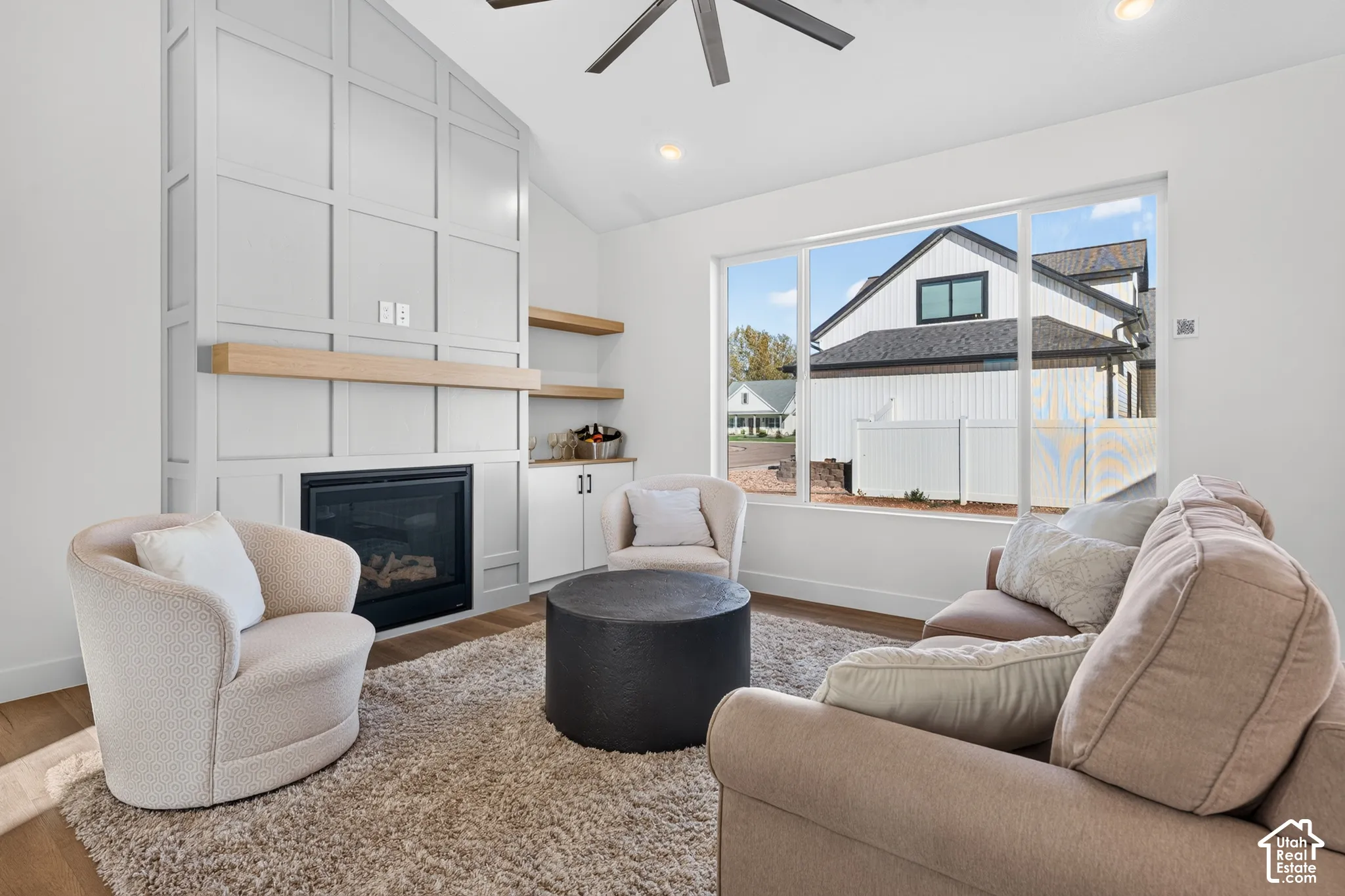 Vaulted ceiling with a ceiling fan and recessed lighting
