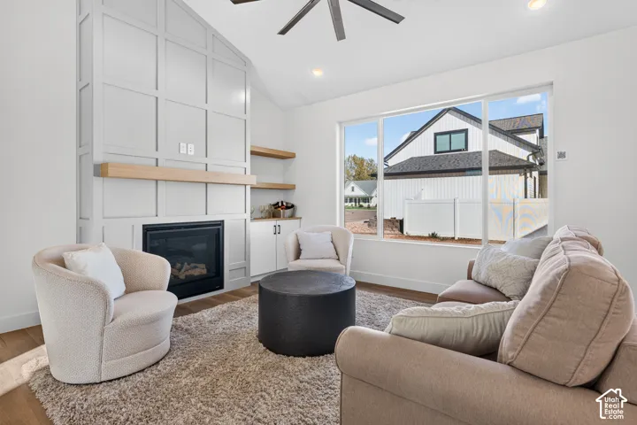 Vaulted ceiling with a ceiling fan and recessed lighting