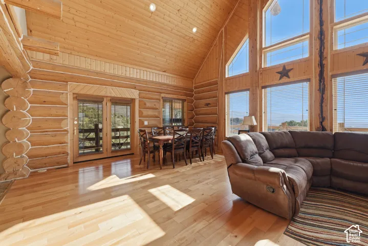 Vaulted wood-paneled ceilings, exposed log walls, and wood-finish flooring