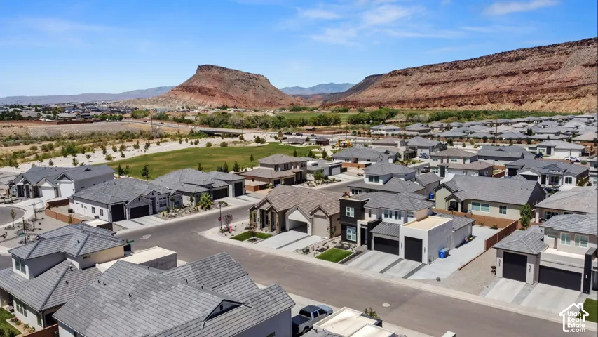 Aerial perspective of a developed residential community with diverse home styles