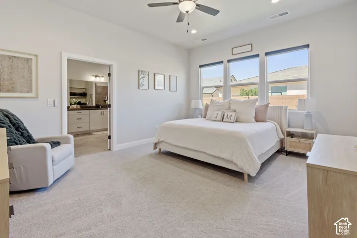 Recessed lighting, ceiling fan, and three large windows