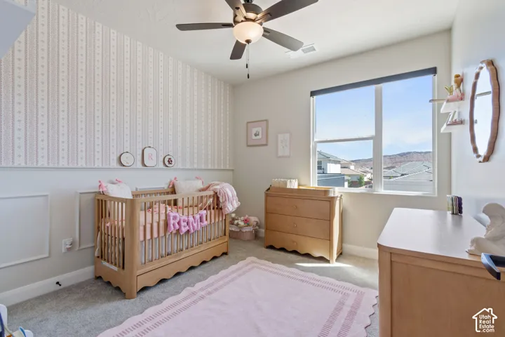 Accent wall with patterned wallpaper and wainscoting