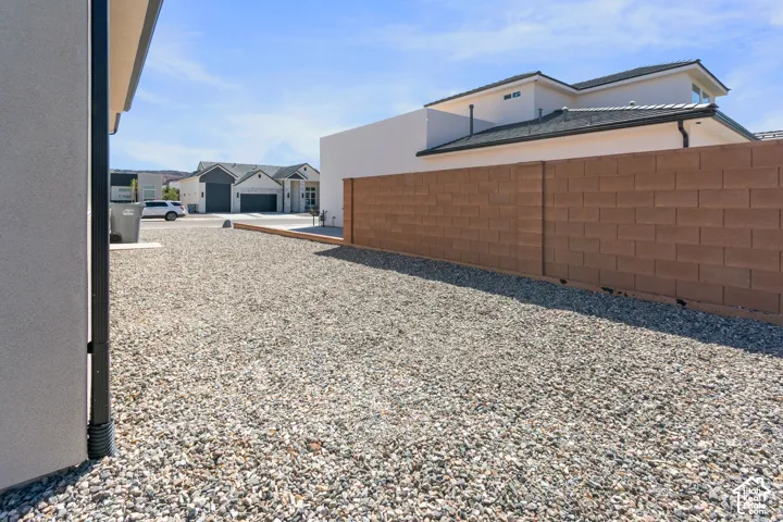 Gravel landscaping with a block wall perimeter