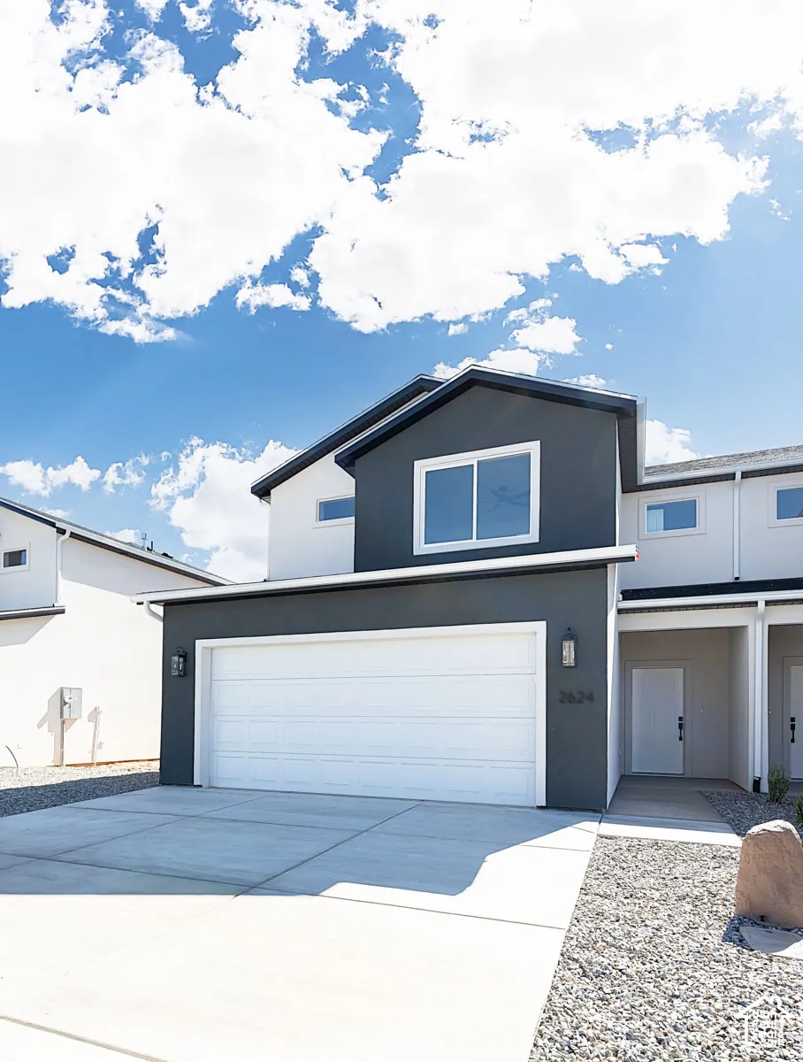 Contemporary exterior with a dark gray and white color palette