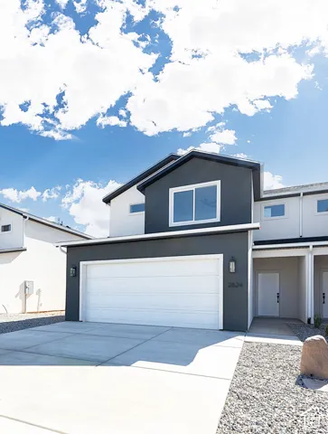 Contemporary exterior with a dark gray and white color palette