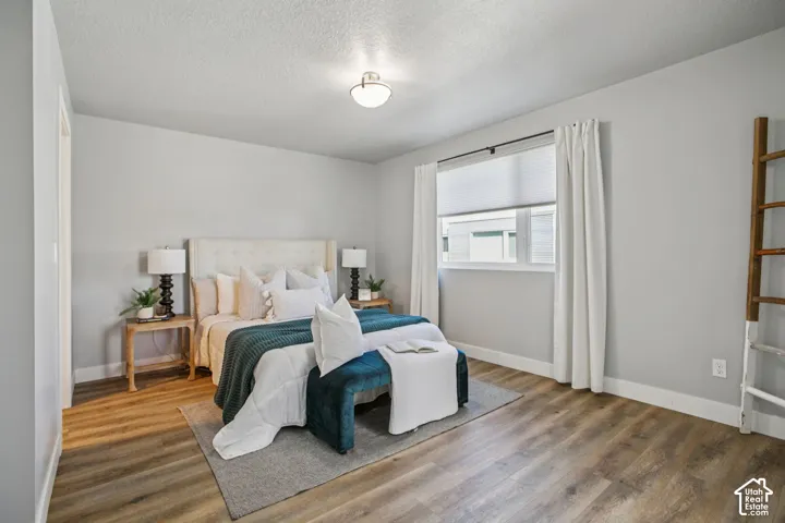 Light gray walls with wood-finish flooring