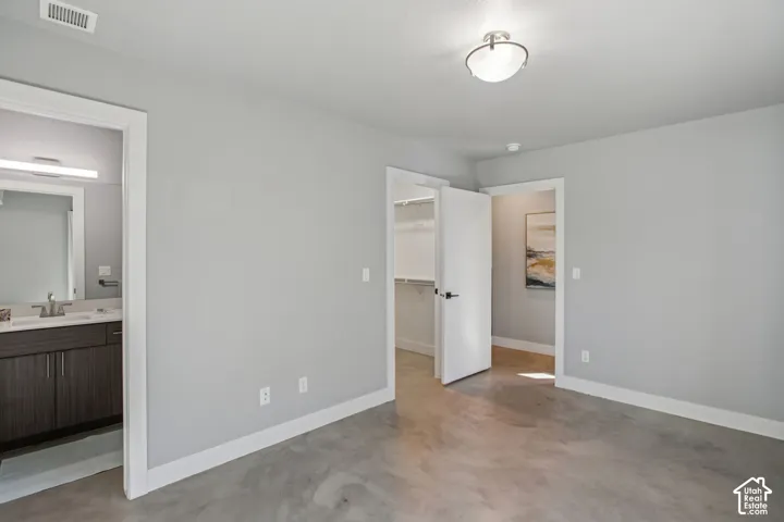Light gray walls complement the polished concrete flooring