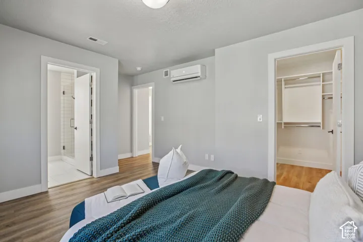 Wood-finish flooring throughout, with a built-in closet organization system and a ductless mini-split climate control unit