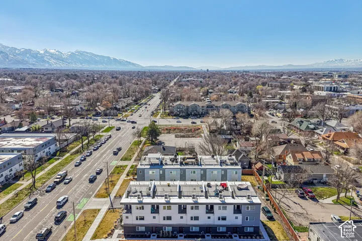 Modern multi-story residential buildings with flat roofs and multiple windows
