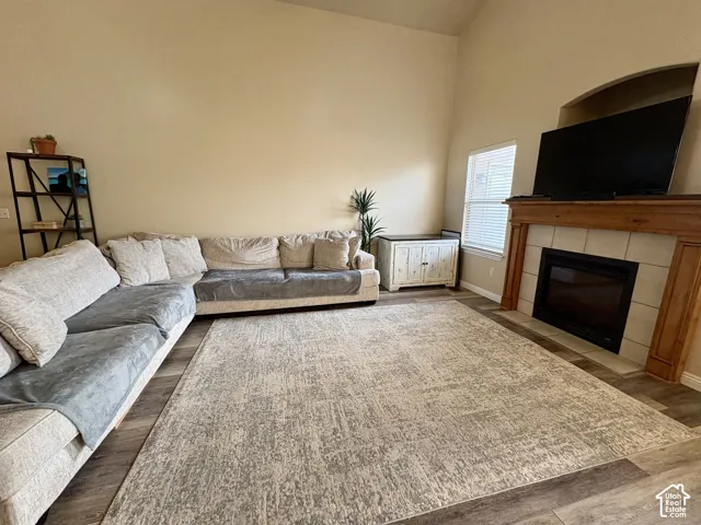 Vaulted ceilings enhance the living space, complemented by wood-finish flooring