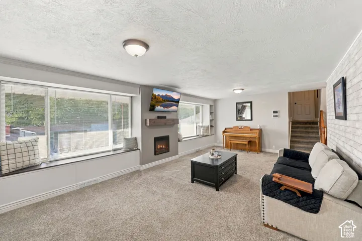 Wall-mounted fireplace with an integrated wood-finish mantel