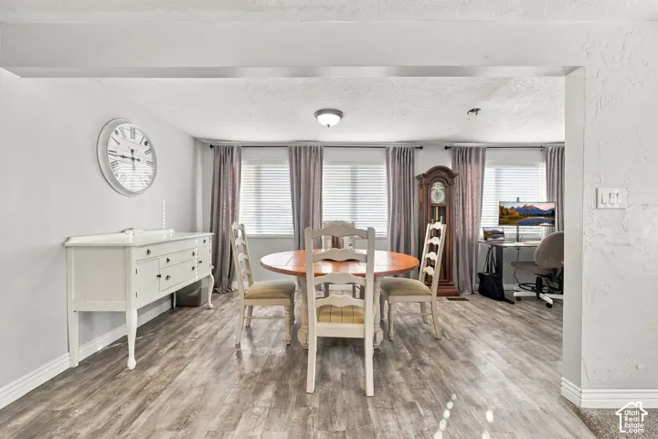 Wood-finish flooring throughout dining space