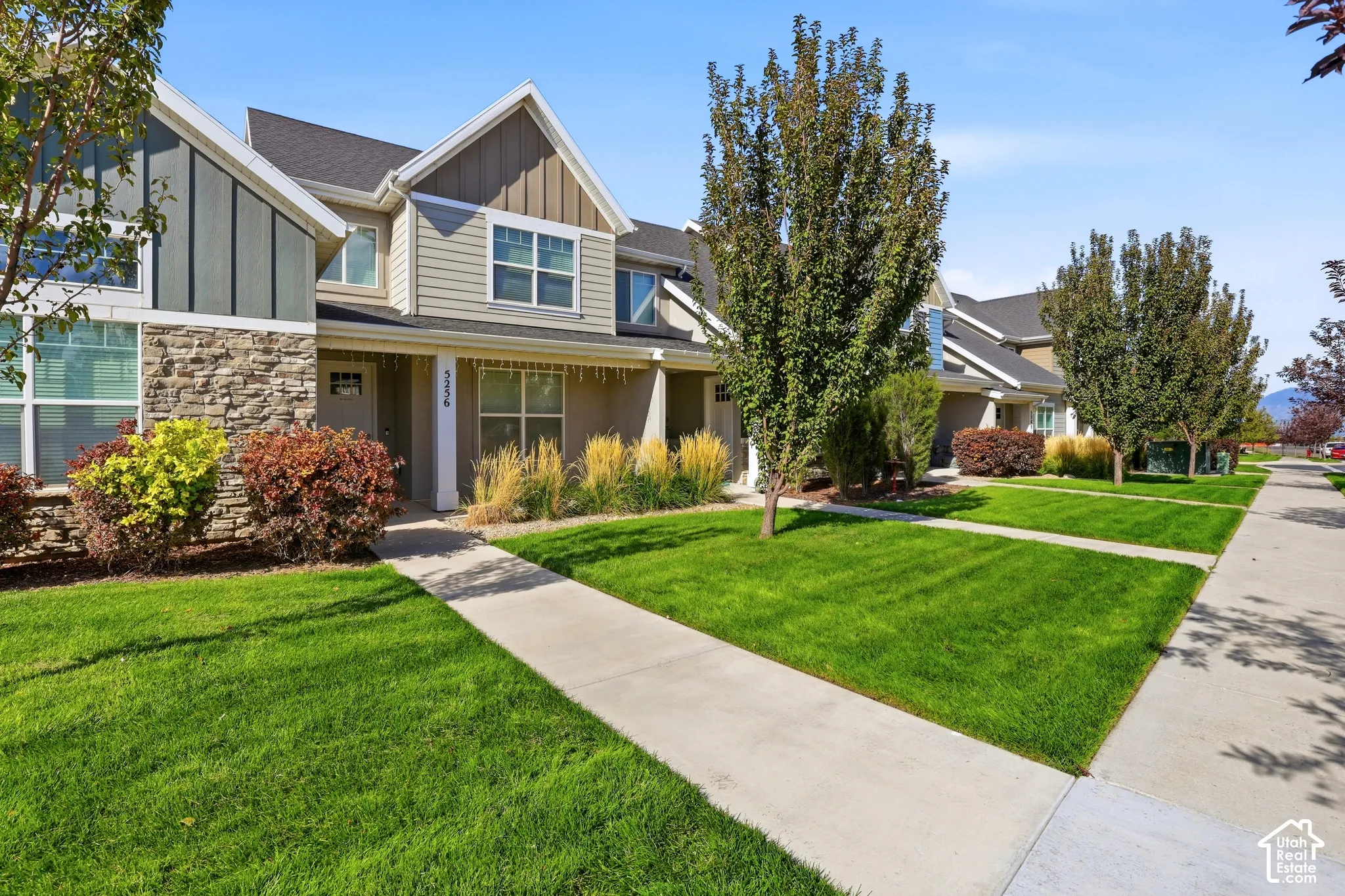 Exterior featuring stone accents, siding, and gabled rooflines