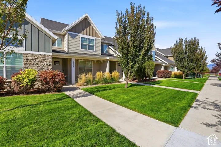 Exterior featuring stone accents, siding, and gabled rooflines