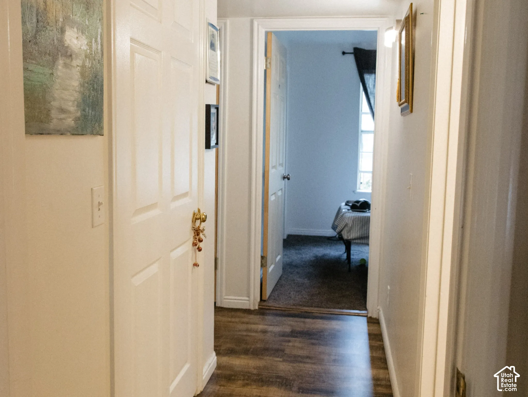 Wood-finish flooring throughout the hallway