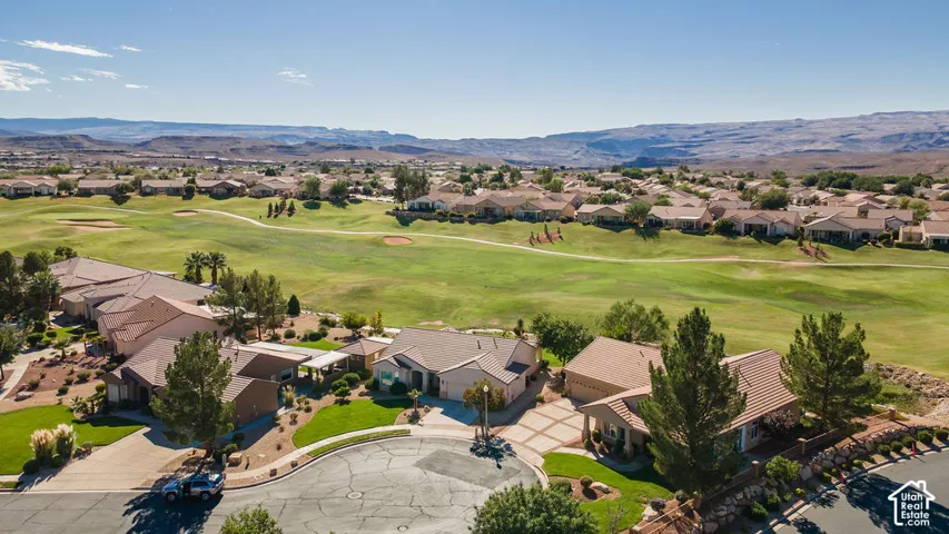 Golf course setting with desert landscaping and mountain scenery