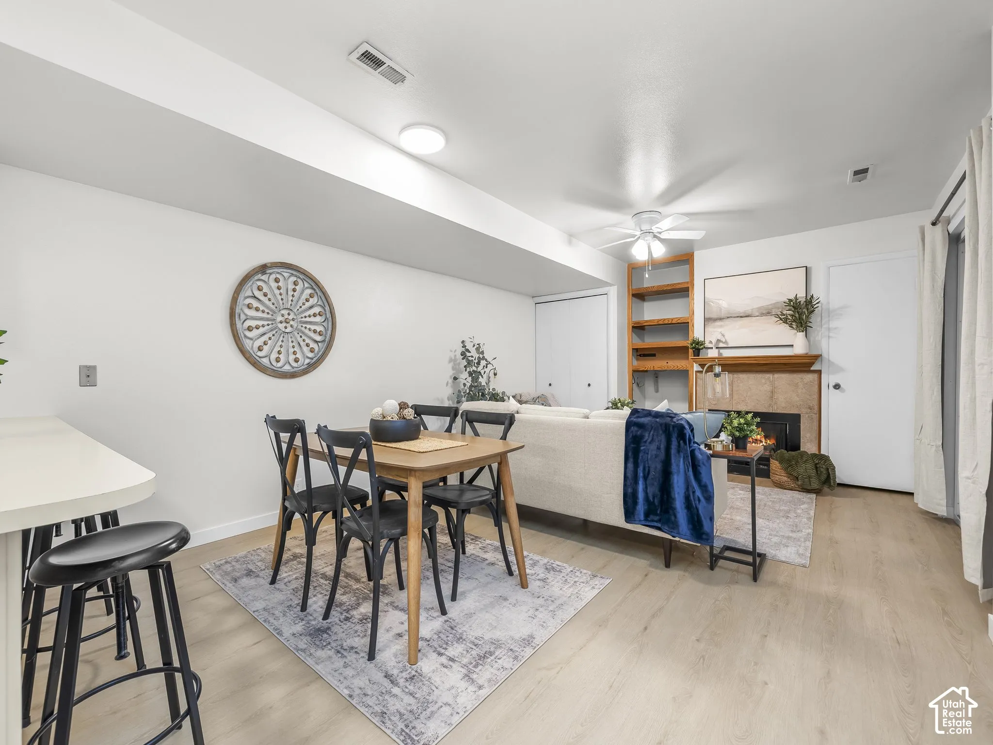 Recessed lighting, wood-finish flooring, ceiling fan, fireplace with hearth, built-in shelving