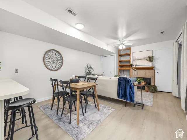 Recessed lighting, wood-finish flooring, ceiling fan, fireplace with hearth, built-in shelving