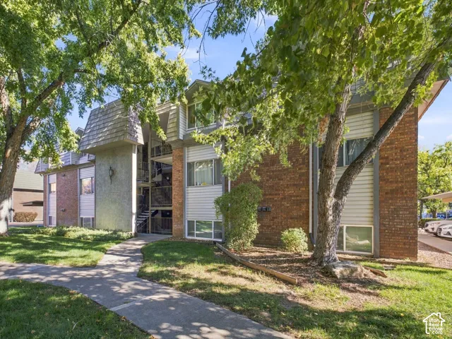 Brick and siding exterior with mature trees