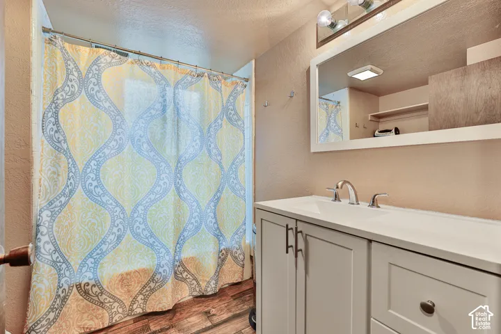 White vanity with dual-door cabinetry and drawer storage