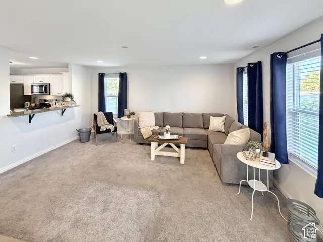 Spacious family room with large windows and tons of natural light