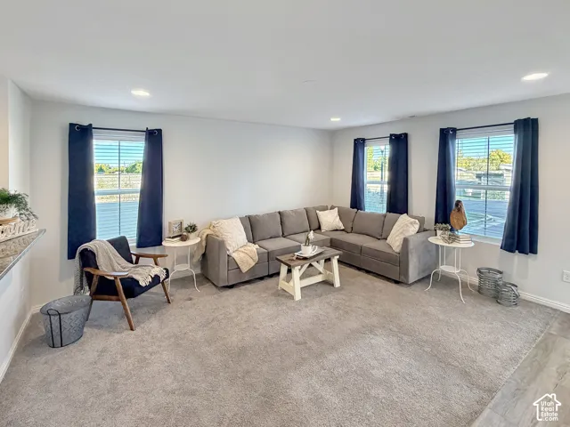 Spacious family room with large windows and tons of natural light