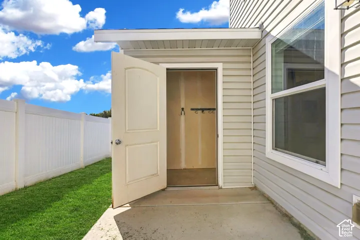 Fully fenced backyard with attached storage shed. Landscaping inside of the fence is maintained by the HOA