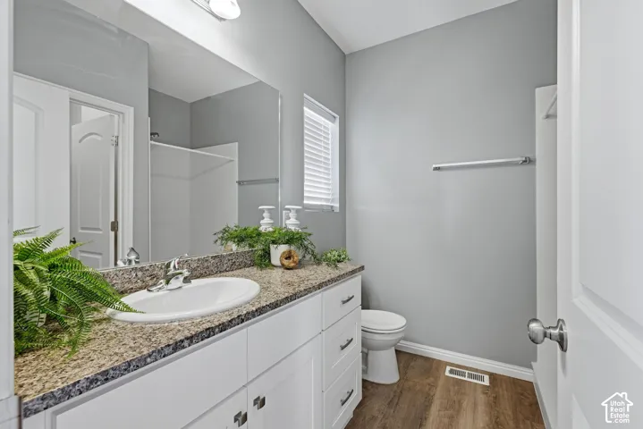 Ensuite bathroom with large vanity, walk in closet and large shower
