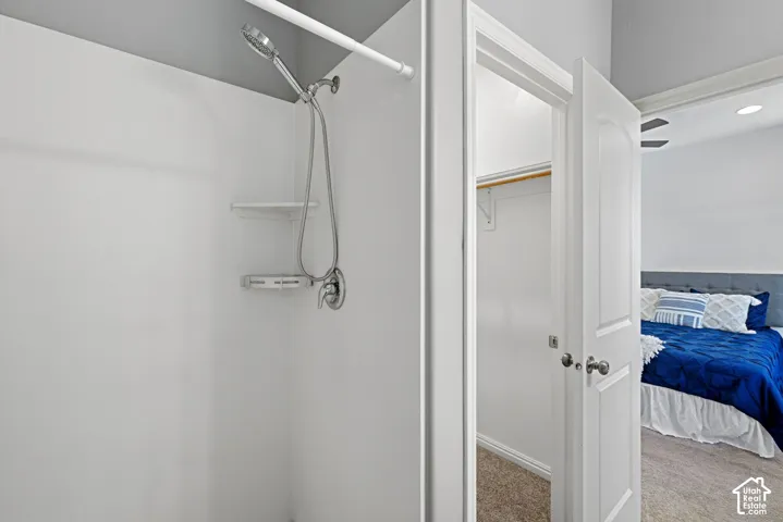 Ensuite bathroom with large vanity, walk in closet and large shower