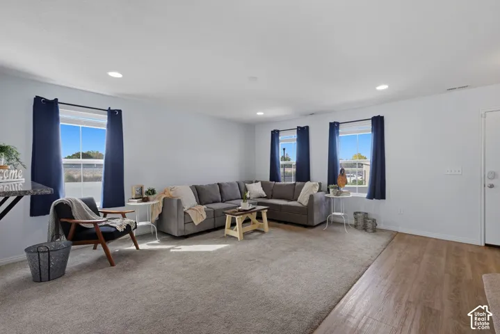 Spacious family room with large windows and tons of natural light