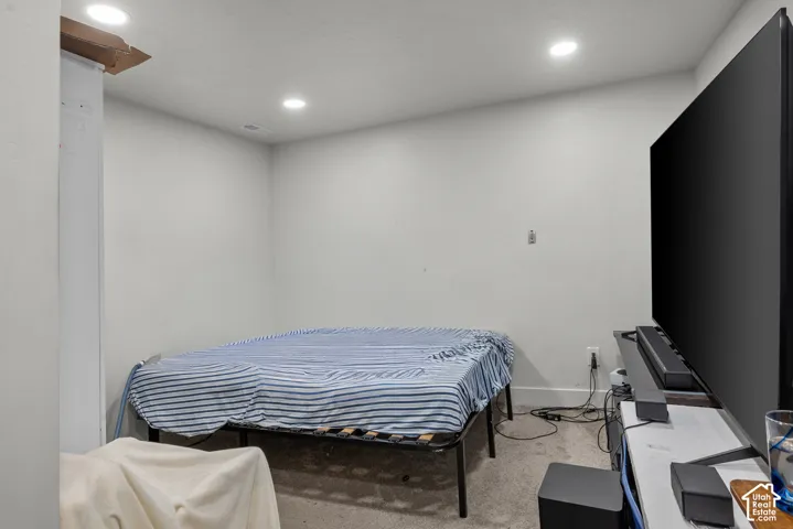 Recessed ceiling lighting within a neutral-toned room