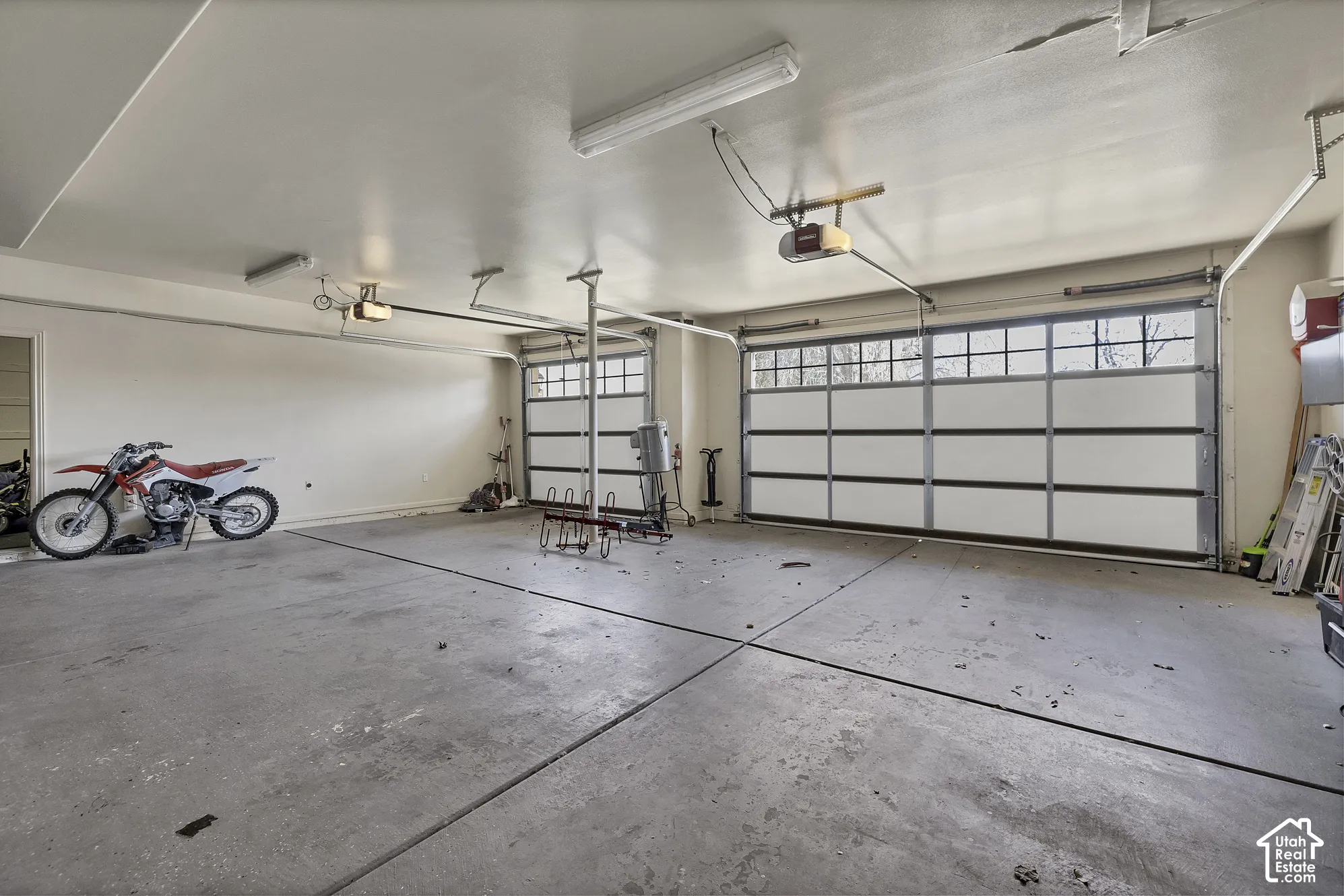 Two overhead garage doors with frosted glass panels